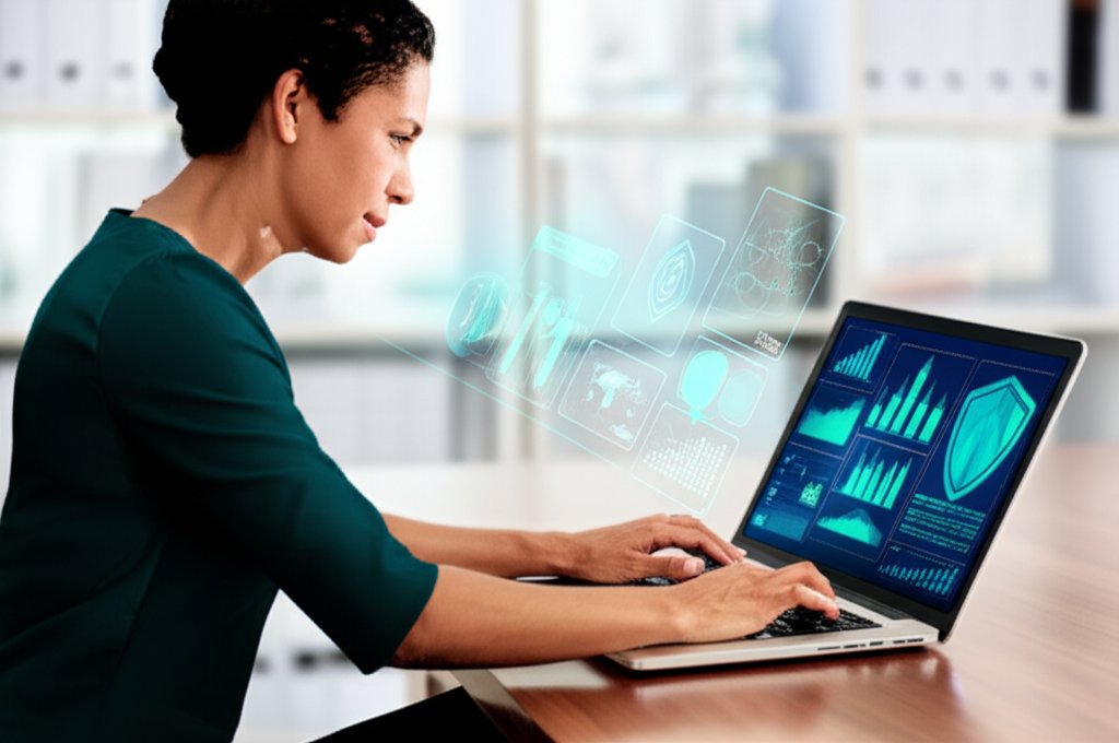 Confident small business owner uses laptop showing AI cybersecurity graphics in a bright, modern office.