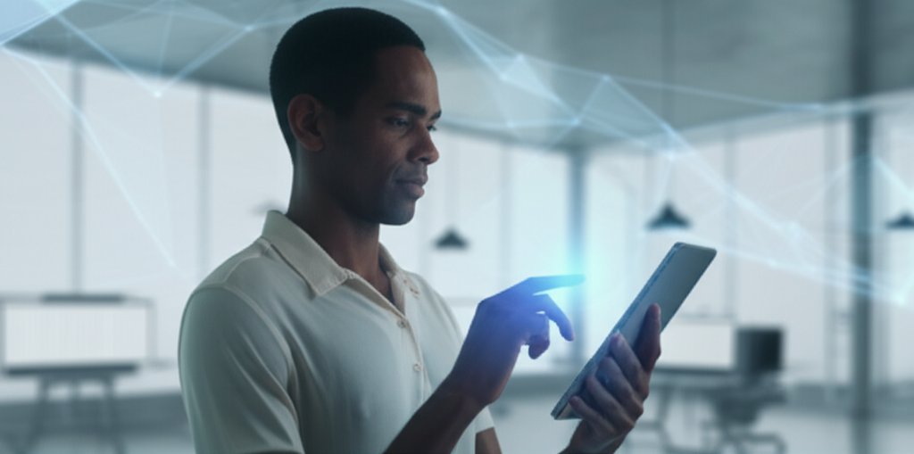 A professional uses a tablet for secure passwordless biometric authentication, with glowing digital network lines.
